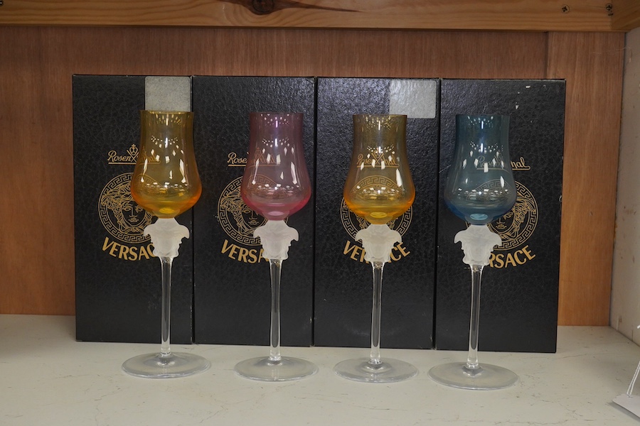 Four boxed Rosenthal for Versace Medusa head grappa glasses in various colours, 21.5cm high. Condition - good.